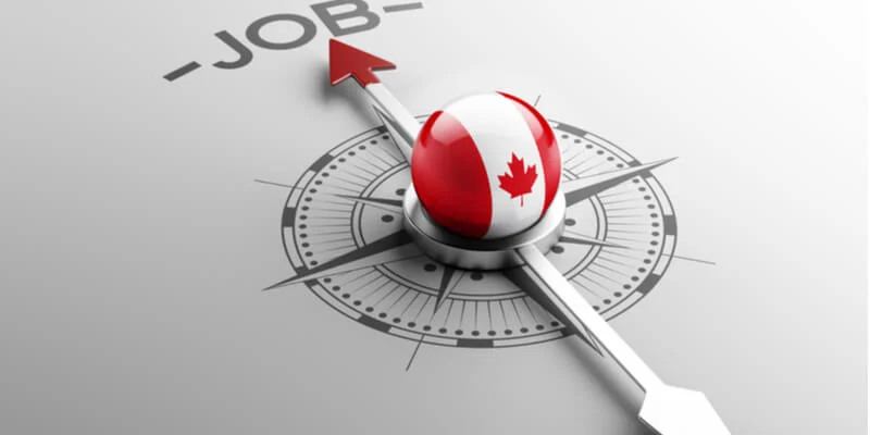 Illustration of a compass marked JOB pointing toward a Canadian marker