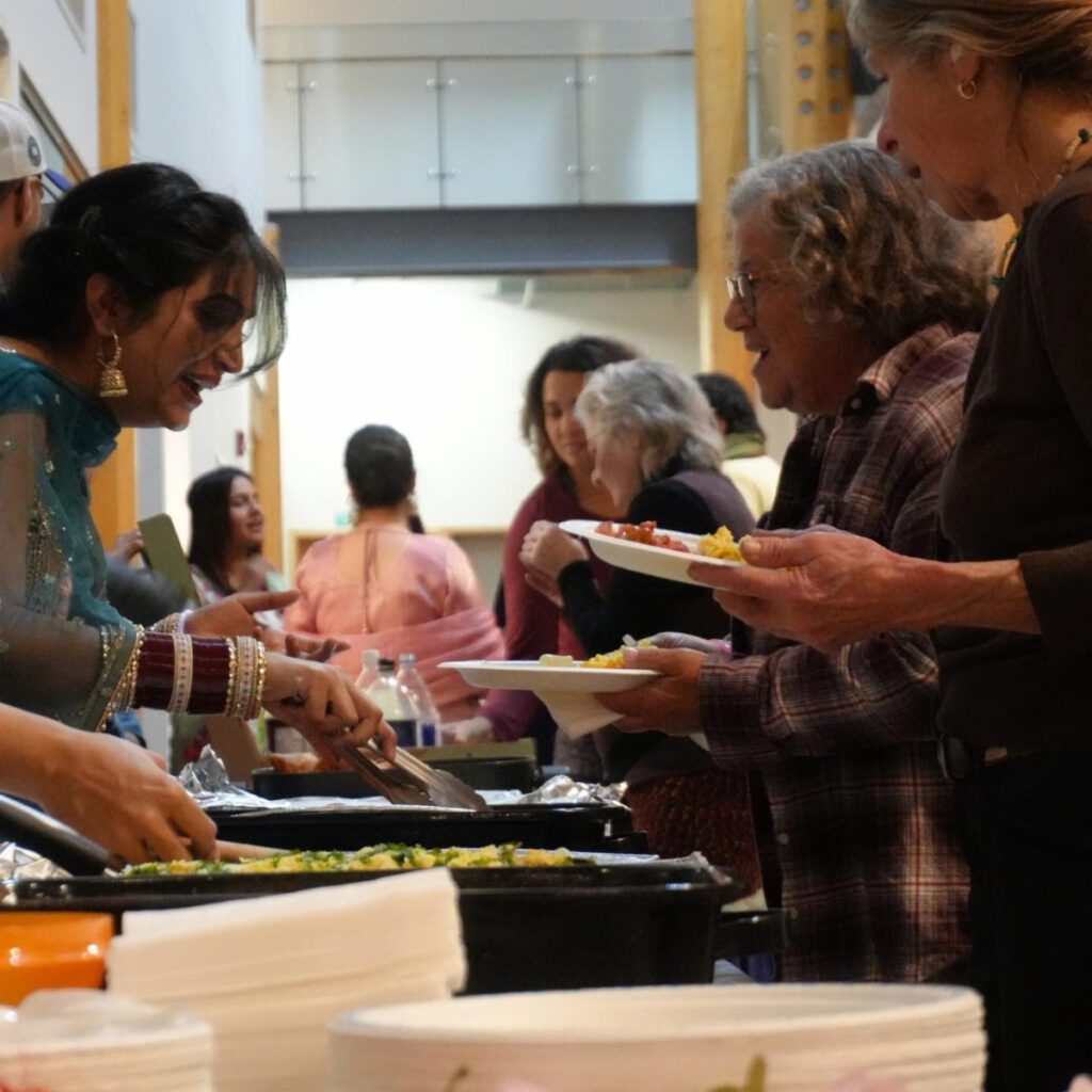 Students sharing traditional food at the Diwali celebration