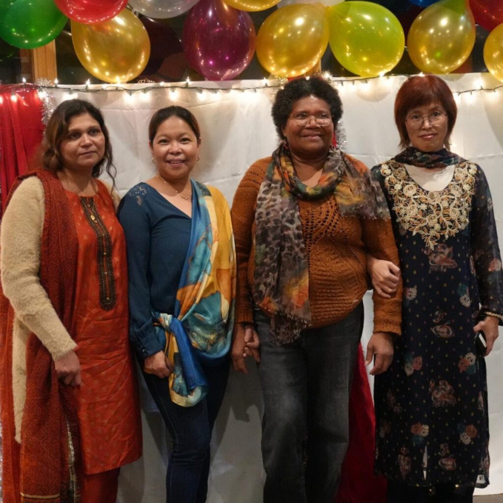 Students and staff in traditional dress at the Diwali event