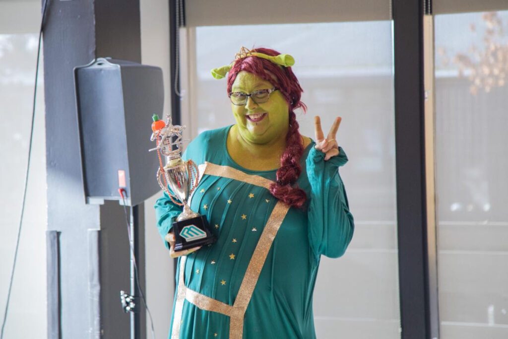 The winning staff costume, keeping the trophy until next Halloween