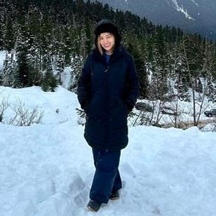 Luchille Erika Ramirez beside a lake in winter